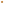         A single chocolate chip cookie photographed from directly above on a plain white background.